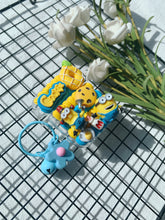 Load image into Gallery viewer, Minions Decoden Earbud Case For Any Model with Keychain
